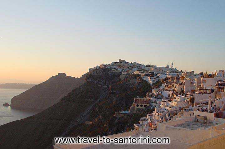 SUNSET FIRA - Fira and Skaros in the afternoon sunset light.
It is the best possible time to spend with a coffee or a drink at the caldera rim. by Gene Burch