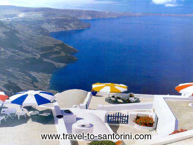 White Cycladic houses - A poster of the island of Santorini, with crisp white Cycladic houses on volcanic cliffs rising from the sea.