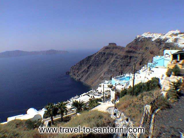 Imerovigli and caldera view - View of the caldera and Imerovigli from Firostefani. Skaros and Thirassia visible in the background.