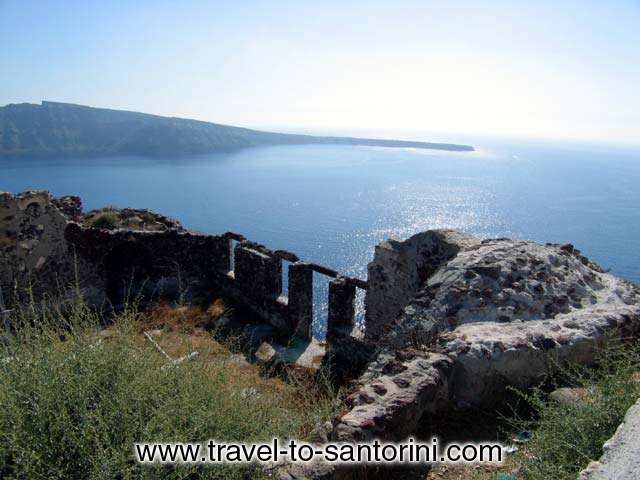 OIA CASTLE - View from within the castle of Oia. This is the edge of the castle where entrance is not allowed for security reasons. Thirassia in the background.