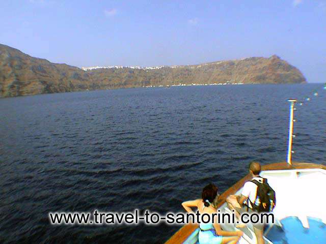 Thirassia view - View of Thirassia from the small boat that makes the tour to volcano and the hot springs. The village Manolas is visible. by Alexandros Damigos