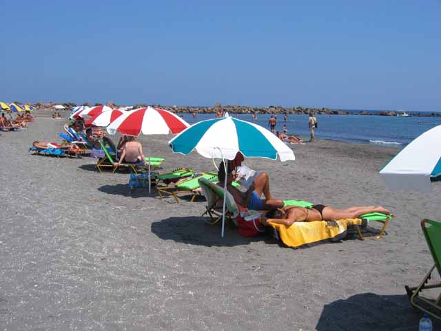 Sunbeds at Monolithos beach - Relaxing at the amazing sandy beach  of Monolithos.