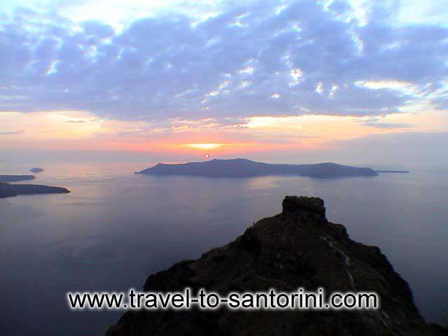 Skaros in Imerovigli and a beautiful sunset in October from Agios Ioannis church  