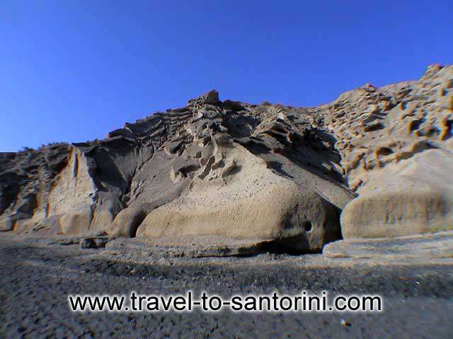 PUMICE STONE FORMATIONS - View of the cliff behind Vlihada beach.