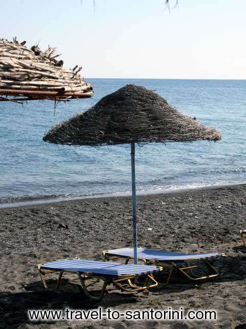 Umbrella on Perivolos beach - Relax under an umbrella in Perivolos beach by Ioannis Matrozos