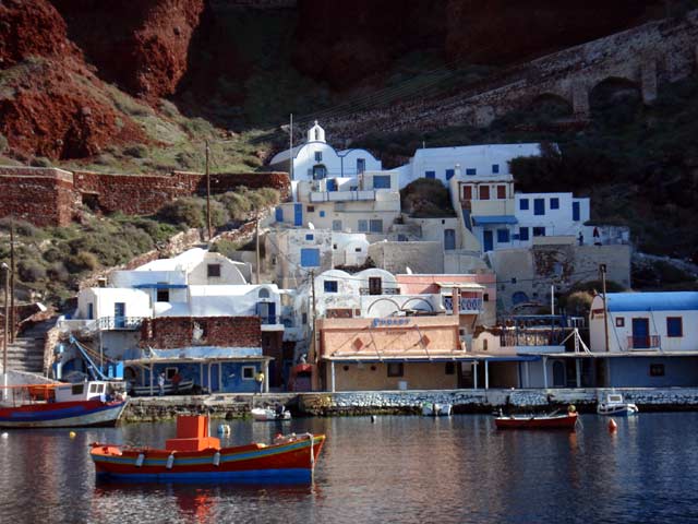 View from the sea - View of Ammoudi and the fishing boats from the sea. Visible the small church on top of the restaurants.