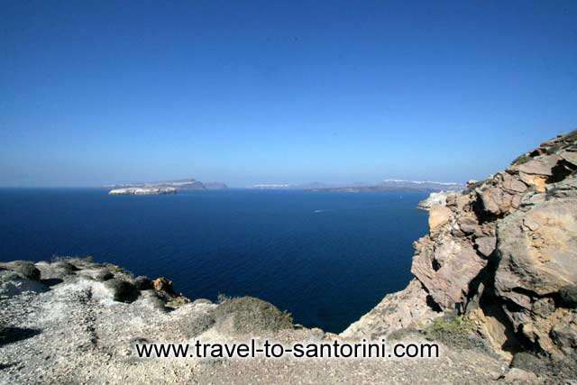 Caldera view - View of Aspronissi, Thirassia, Oia and the volcano from Akrotiri lighthouse by Ioannis Matrozos