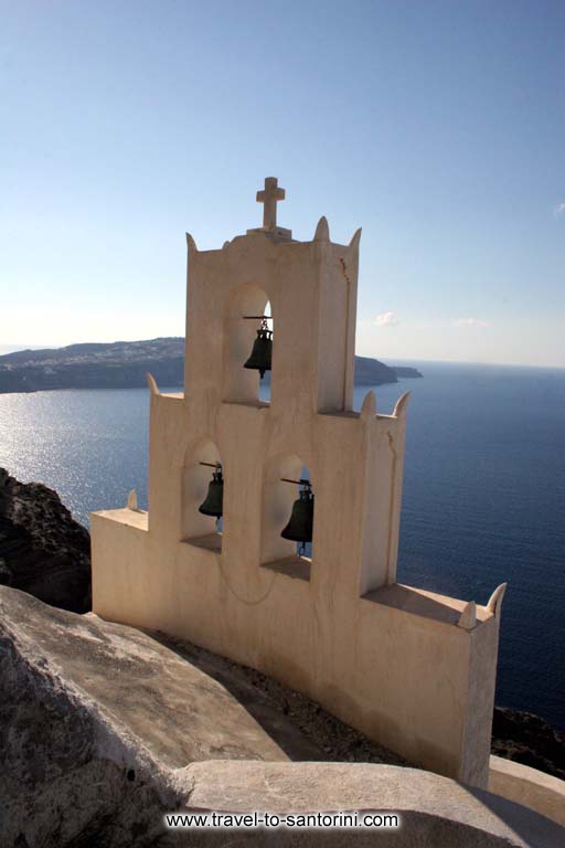 Church caldera - View of a church bell at the caldera rim in the area of Megalochori above Plaka hot sping.