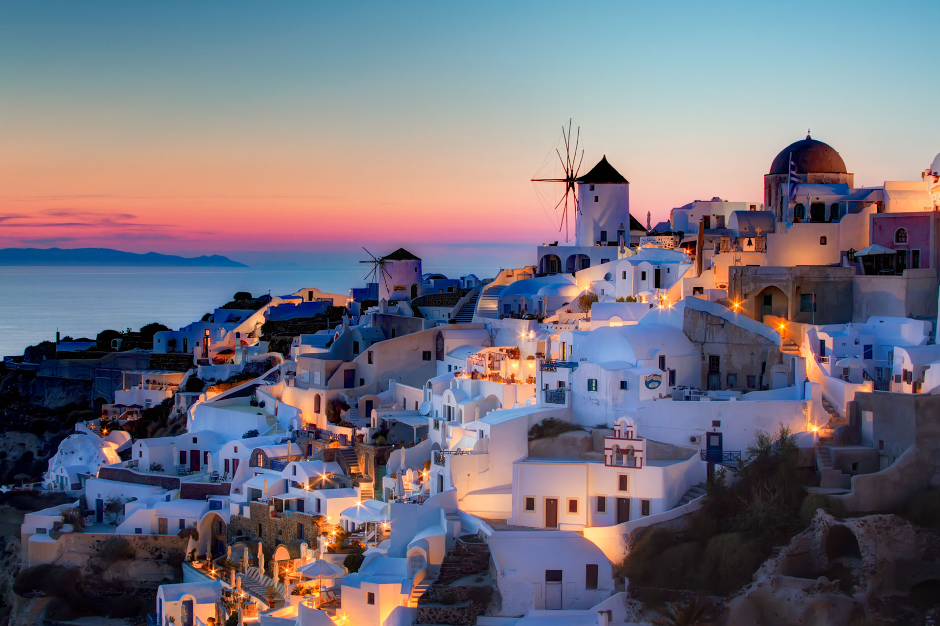 Sunset in Oia, Santorini - The sun setting over the picturesque town of Oia, Greece by Pedro Szekely