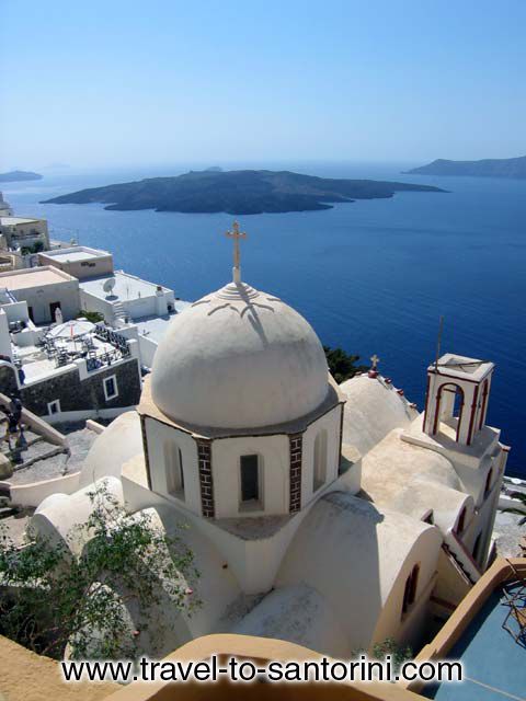 Church in Fira, Nea Kameni (volcano) in the background  