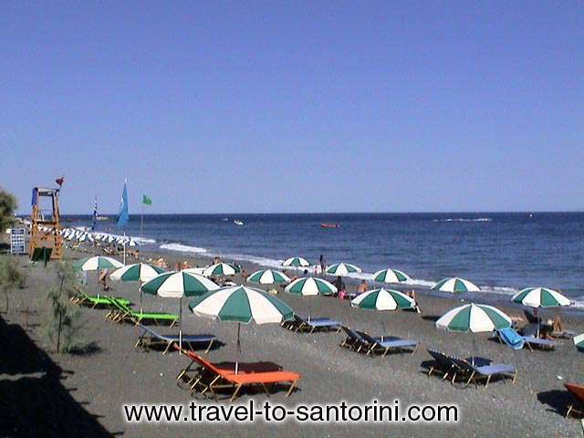 KAMARI BEACH - Kamari is a well organised beach. There are plenty of restaurants, cafes, umbrellas, watersports etc.