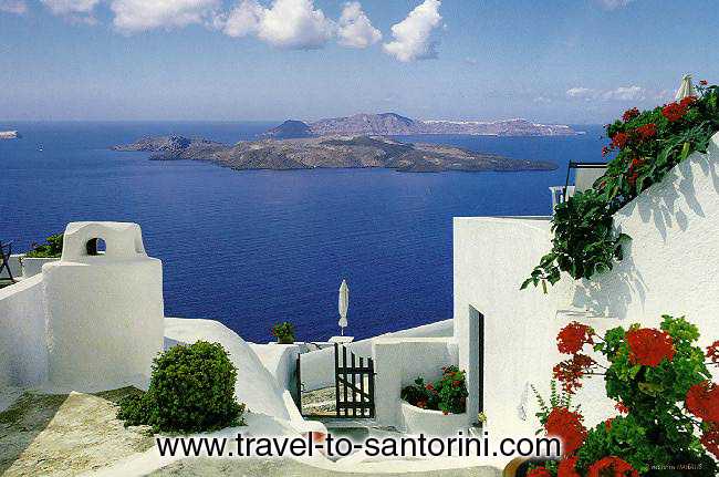 View of the volcano and Thirassia from the small yard of a traditional house in Imerovigli. <br>This exact location (next to Anastasis church) is one of the best spots in Santorini for the view! SANTORINI PHOTO GALLERY - VOLCANO AND THIRASSIA