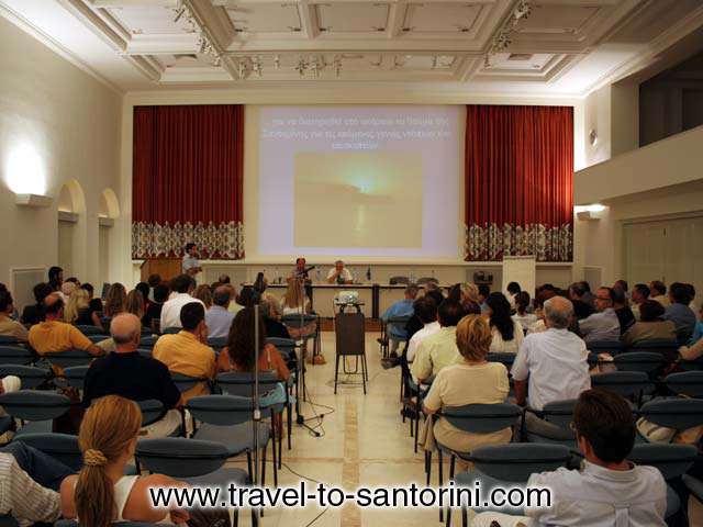 Professor Michael Romanos leading a University of Cincinanati Sustainable Development Group presents the study Plan for the Future of Santorini. A Model for Environmental Tourism in Santorini. Tourism of the future is based on economics – where it’s cheap to go – leaven...