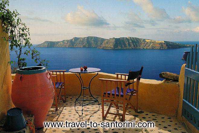 View of Thirassia from the small yard of a traditonal Santorini house in Oia.  